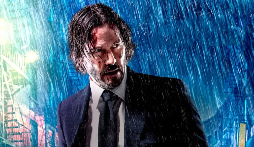 Keanu Reeves como John Wick em cena de ação do terceiro filme da franquia