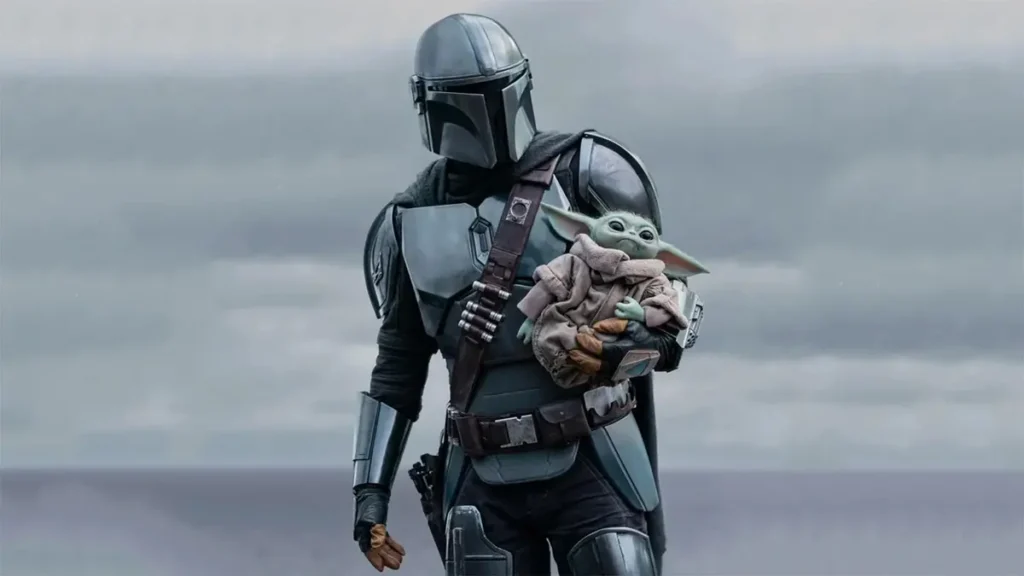 Grogu aparece ao lado de Din Djarin em cena de O Mandaloriano e Grogu, filme de Star Wars com estreia nos cinemas