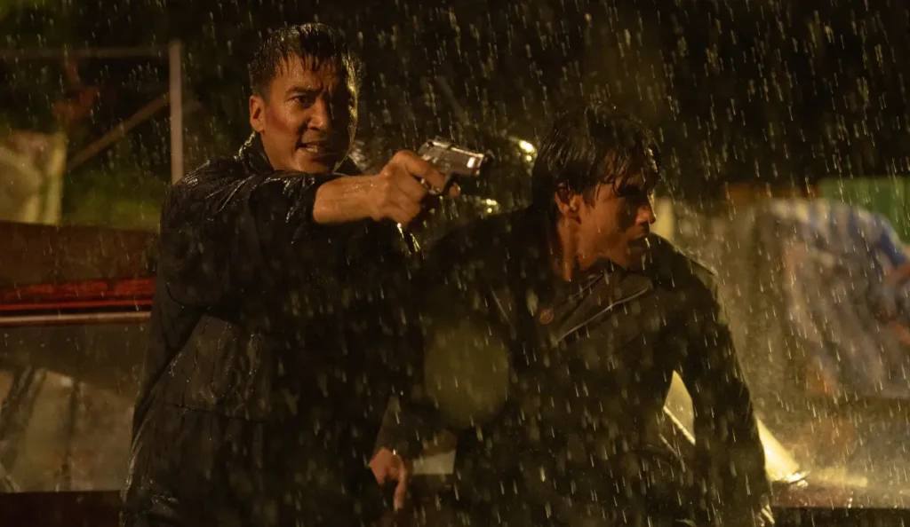 Num aparece durante os acontecimentos finais do filme O Cobrador de Dívidas, da Netflix